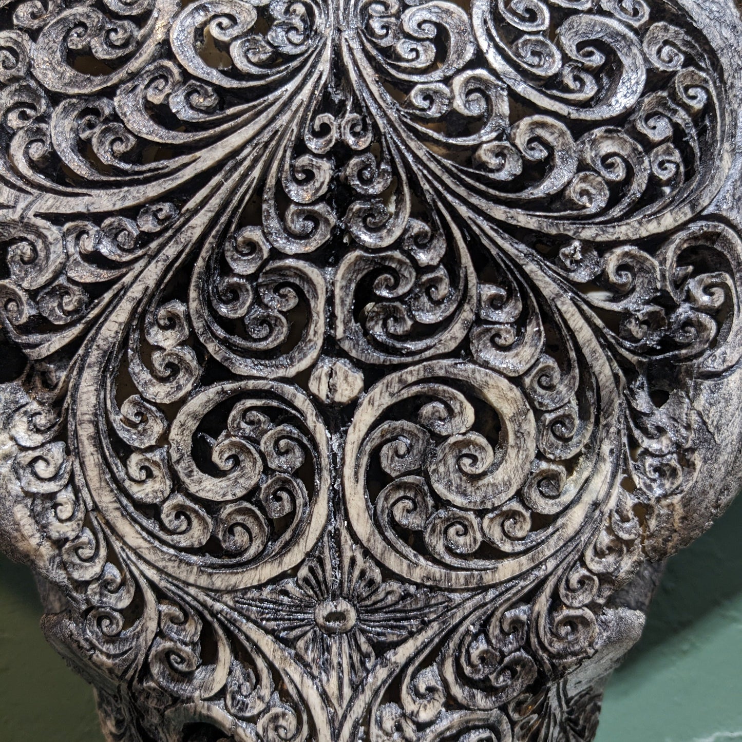 Dark hand-carved buffalo skull